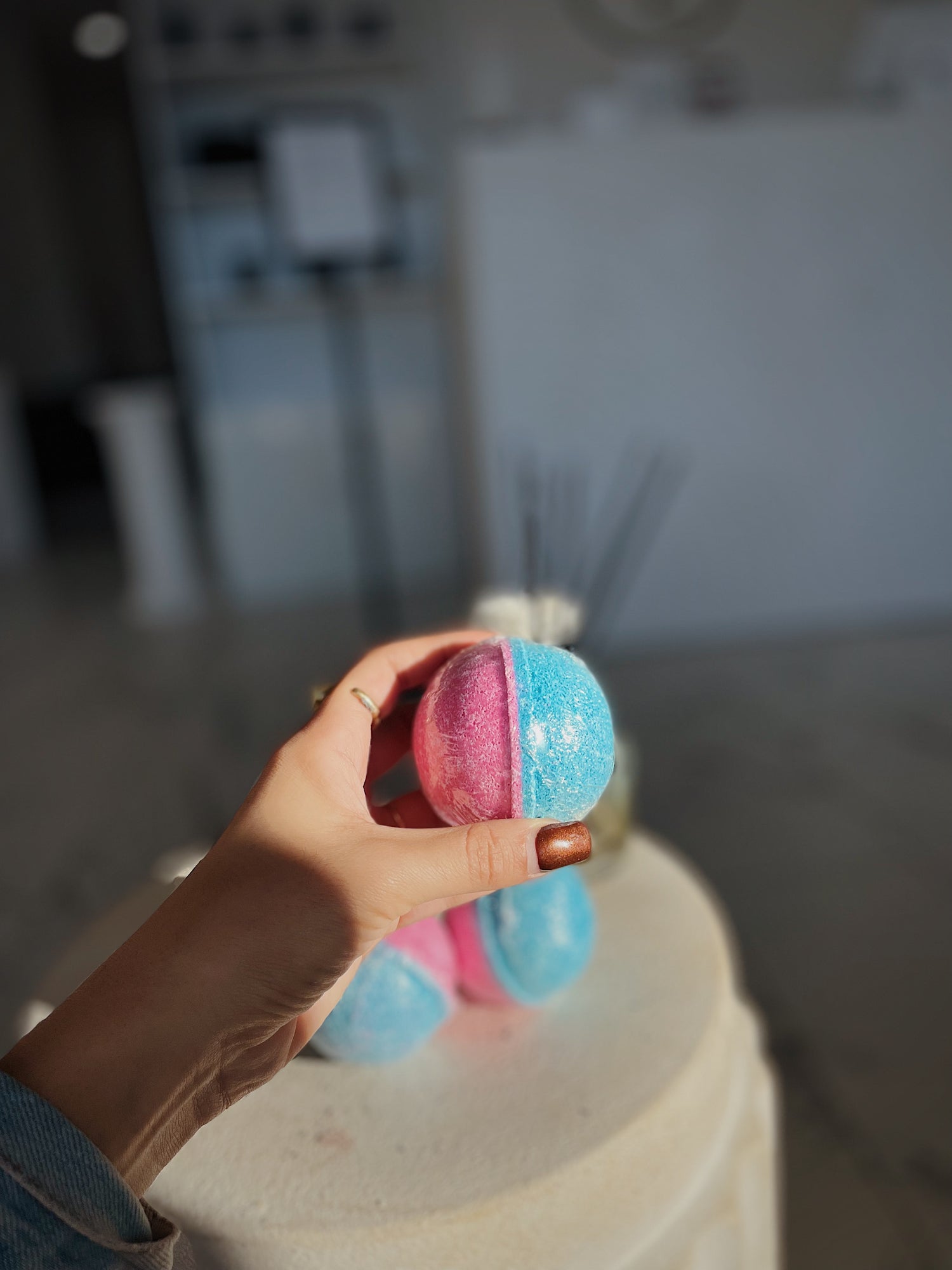 Hand holding the Sweet Like Candy- Cotton Candy Bath Bomb - Blakely Bath