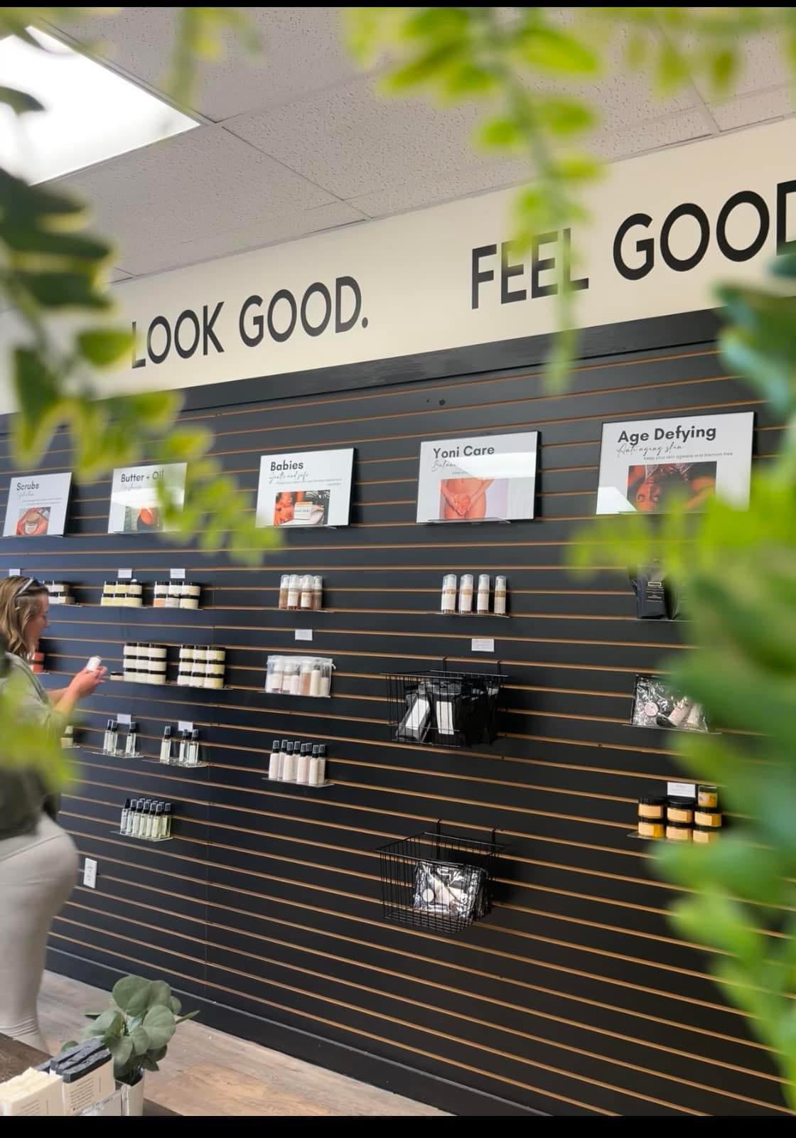Image of the inside of the store with products on a black wall