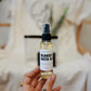 Acne Kit - hand holding the Natural Face Oil Moisturizer