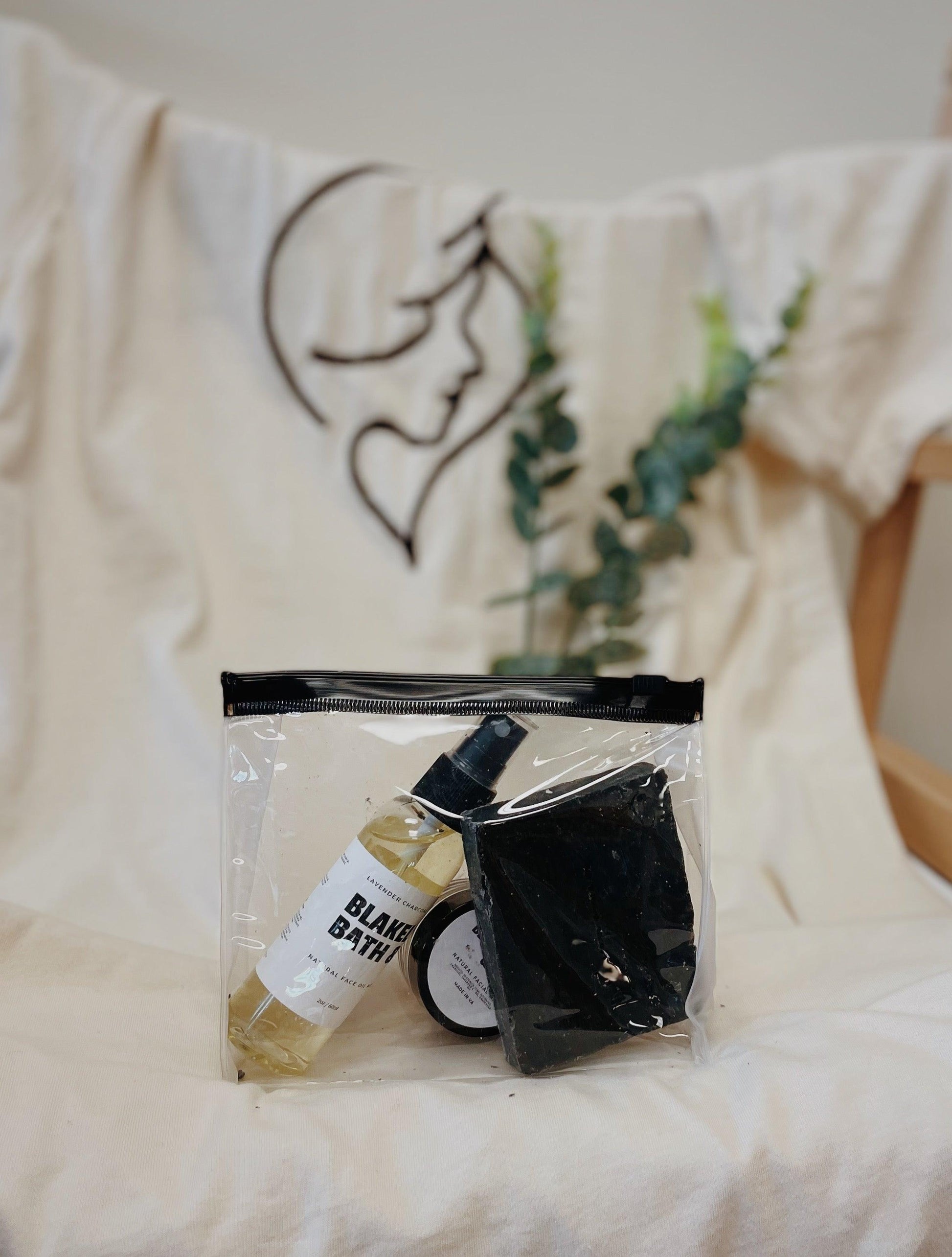 Image of the Acne kit with three small products: Natural Face Oil Moisturizer, Natural Facial Mask, and the Lavender Charcoal Soap Bar