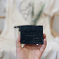 Acne Kit - hand holding the Lavender Charcoal Soap Bar