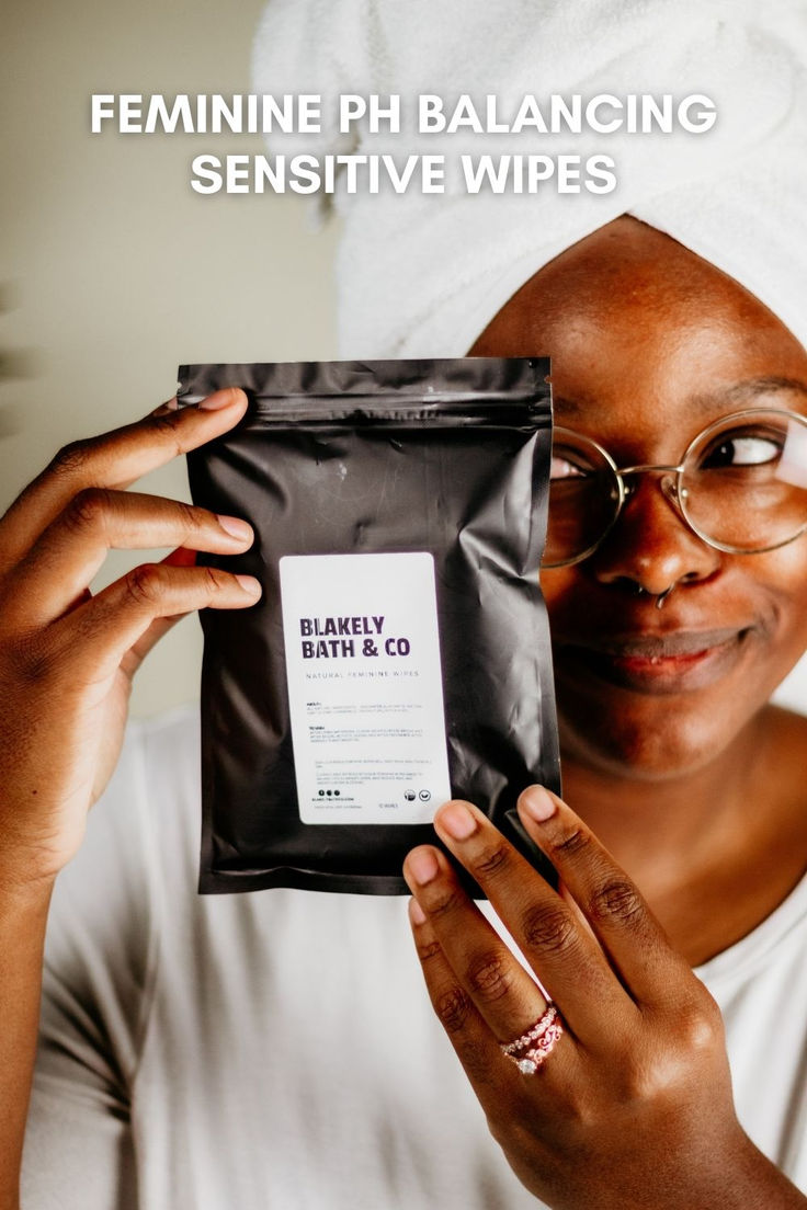 Shana Black holding Blakely Bath & Co Feminine Cleansing & pH Balancing Wipes, showcasing the natural, pH balancing wipes designed to provide gentle cleansing and freshness