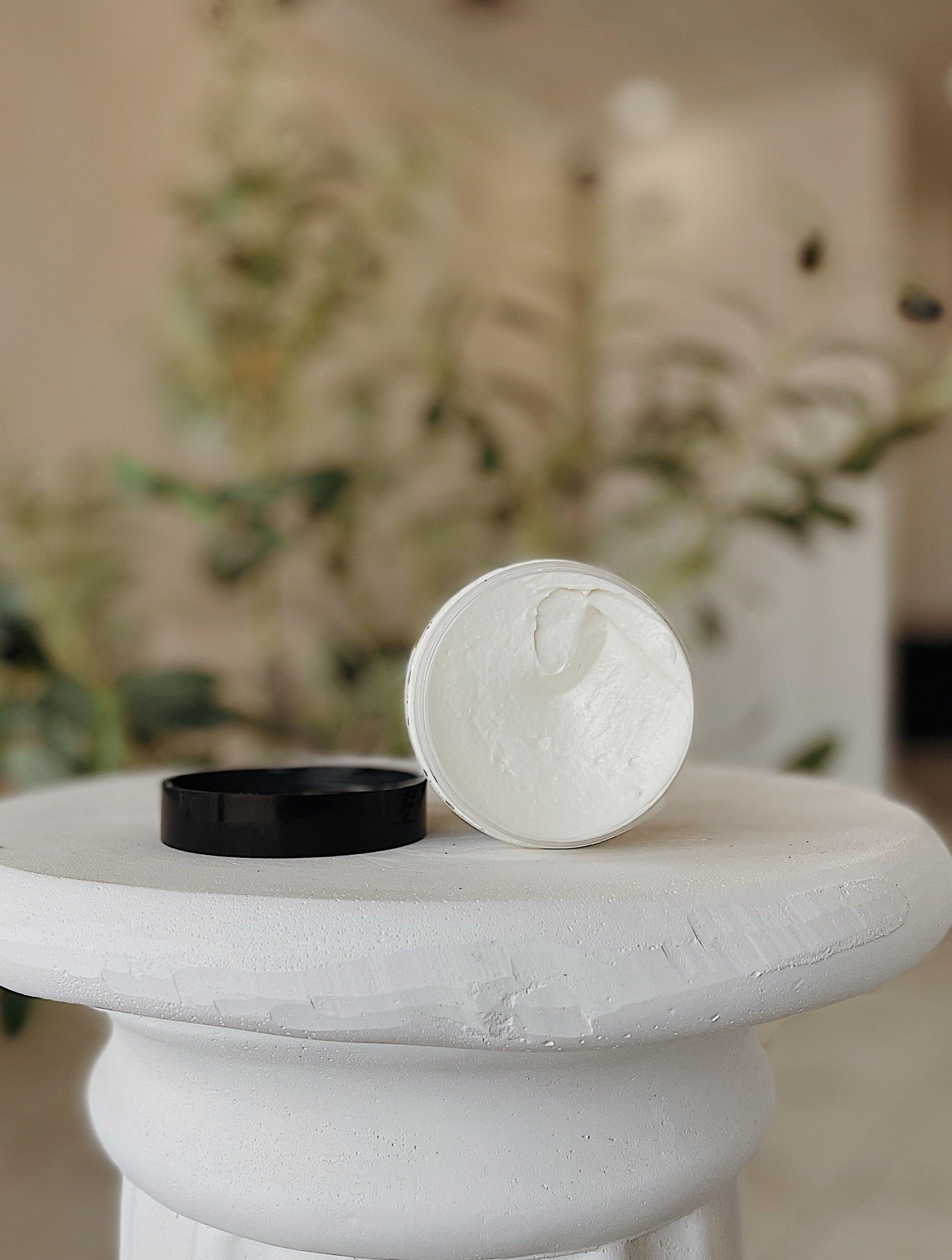 Close-up of Hot Girl Face and Body Butter by Blakely Bath & Co, showcasing its smooth, creamy texture as it effortlessly melts into the skin for deep hydration and a glowing, tropical-scented finish
