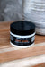 Jar of Hot Girl face and body butter by Blakely Bath Co on a wooden surface.