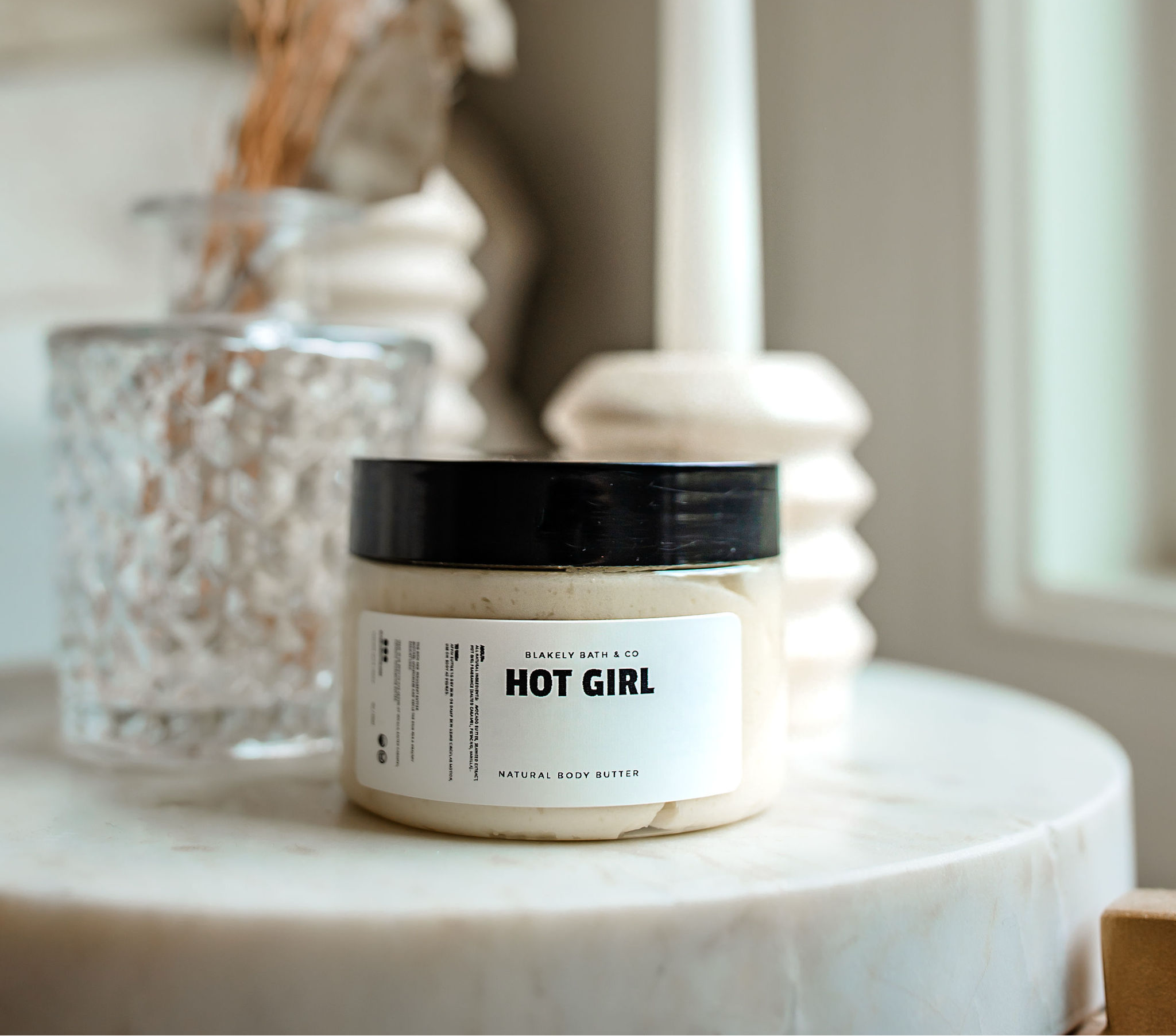 Hot Girl Face and Body Butter by Blakely Bath & Co, a rich, moisturizing cream designed to hydrate, smooth, and nourish skin, leaving it soft and glowing with a warm, bum bum scent