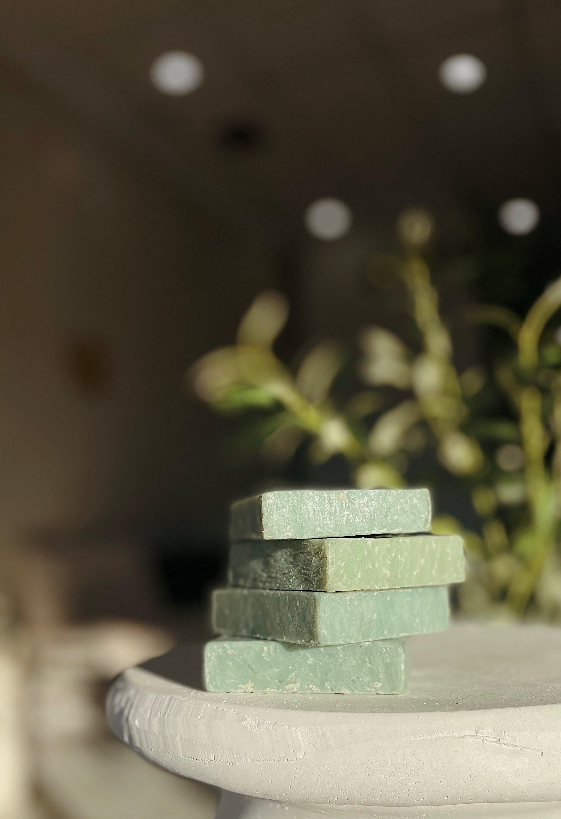 Stack of Legendary men's soaps by Blakely Bath & Co, crafted with goat's milk for deep cleansing and refreshing the skin, with powerful natural ingredients for smooth, hydrated skin