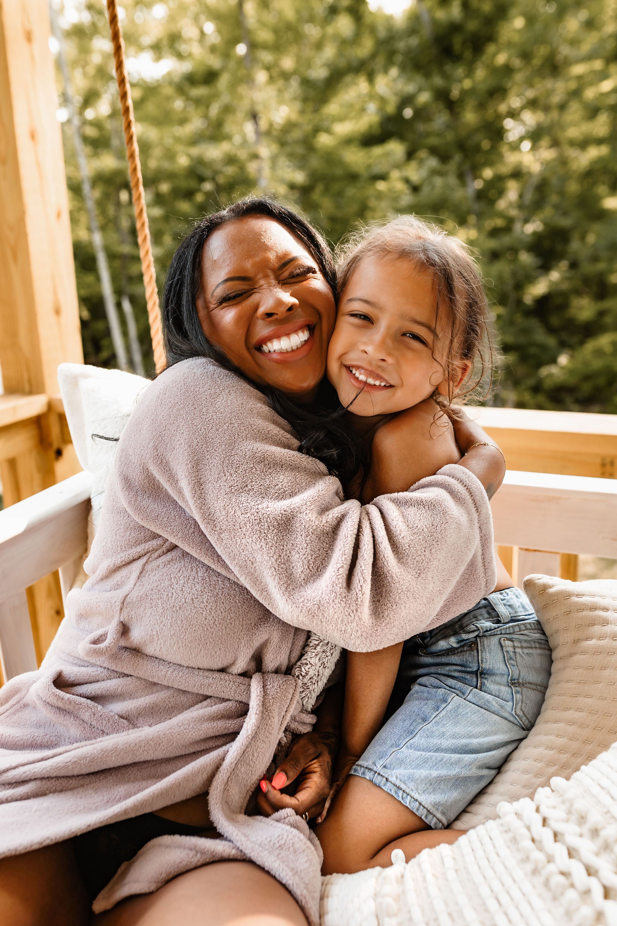 A mother holding her son in a candid, affectionate moment, reflecting the heart behind a clean, non-toxic skincare brand built for moms and families.