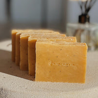 Pomegranate Pear Exfoliation Soap Bar by Blakely Bath & Co, with natural exfoliants to gently buff and refresh skin, leaving it smooth and revitalized with a fruity, refreshing scent