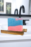 Colorful Sweet Like Candy soap bar on a wooden soap dish by Blakely Bath & Co