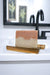 Cherry Almond soap bar by Blakely Bath and Co of soap on a wooden soap dish with a blurred bathroom background