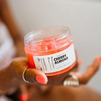 Blakely Bath & Co Cherry Almond Body Scrub, a luxurious exfoliating scrub with natural ingredients to remove dead skin cells, leaving skin soft, smooth, and hydrated with a sweet cherry almond scent
