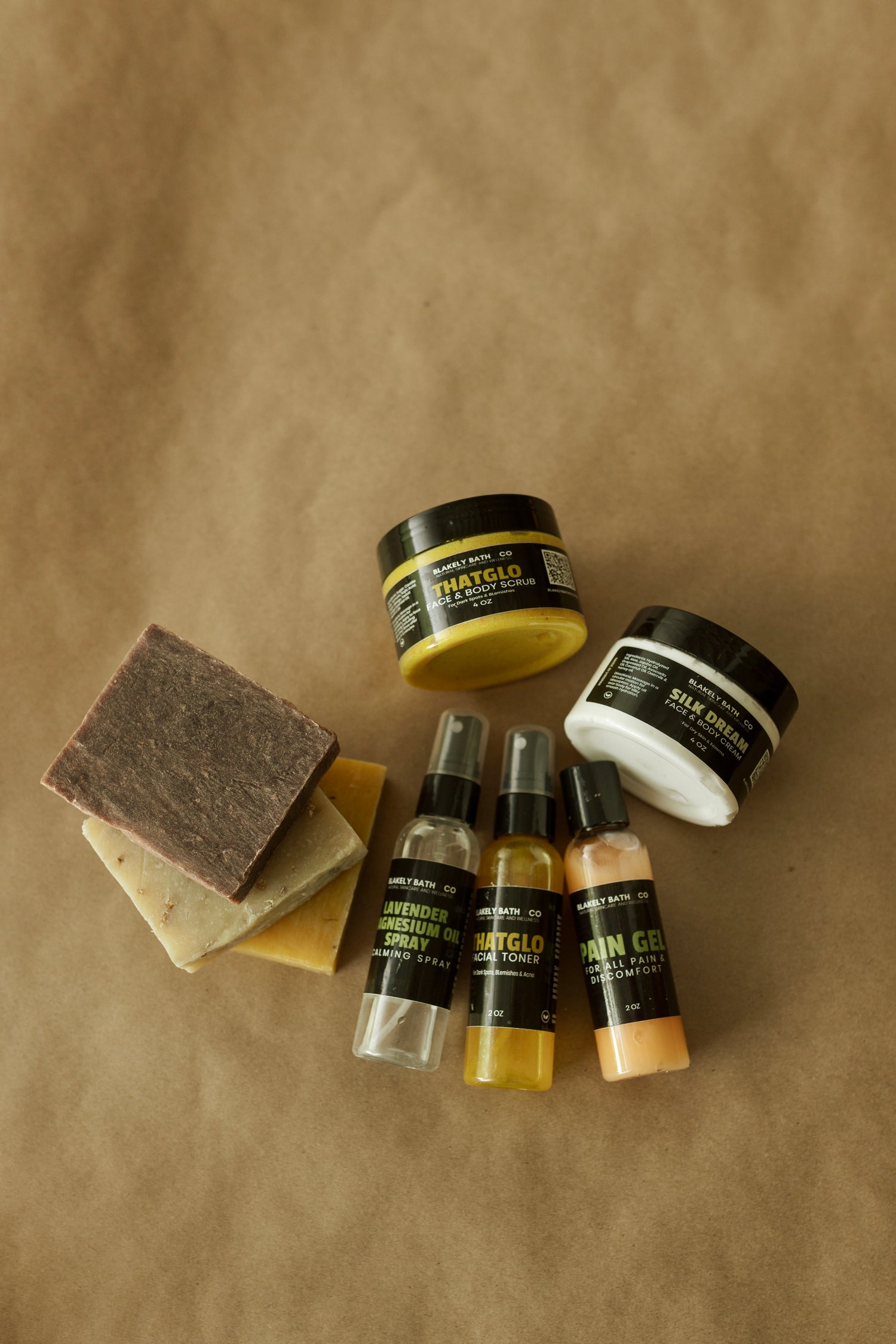 Collection of skincare and grooming products on a brown background
