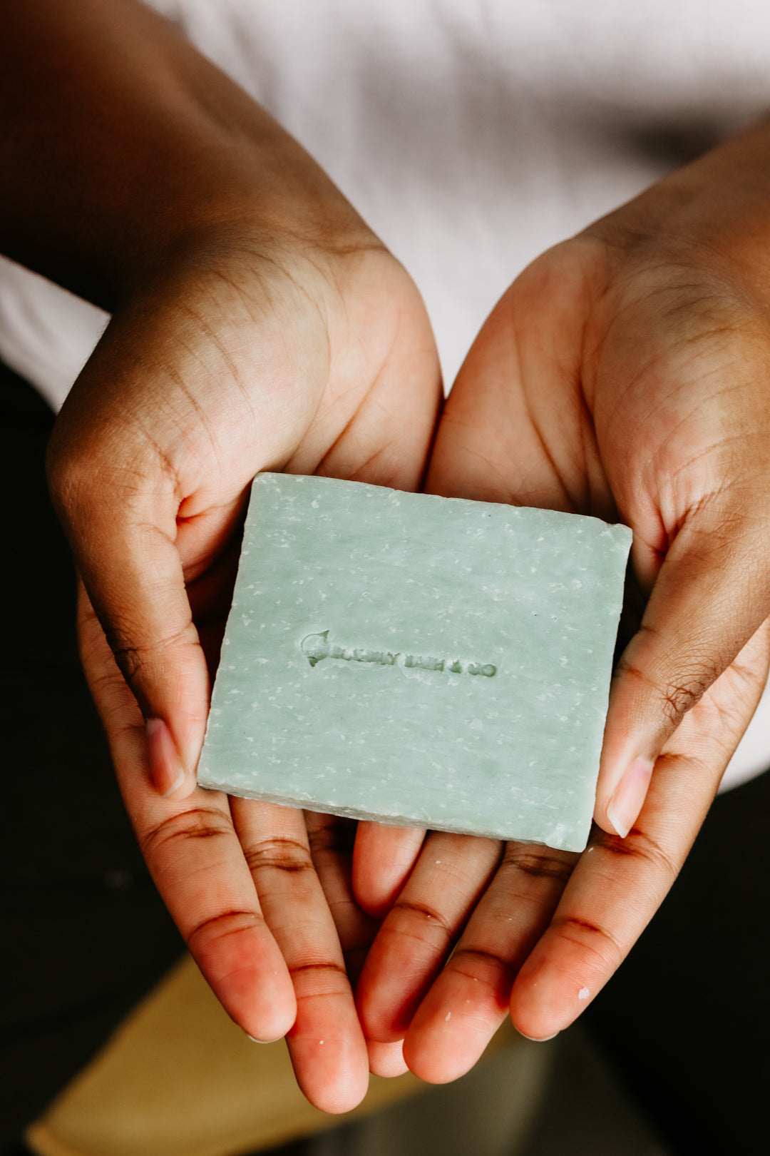 Holding Legendary men's soap bar by Blakely Bath & Co in hands