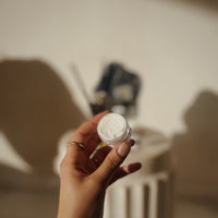Travel-size Silk Dream Moisturizing Cream by Blakely Bath & Co from Bath Body Store – Tessa Chaplin’s hand shows the compact container’s back, emphasizing nourishing, hydrating benefits for dry, sensitive, on-the-go skincare.