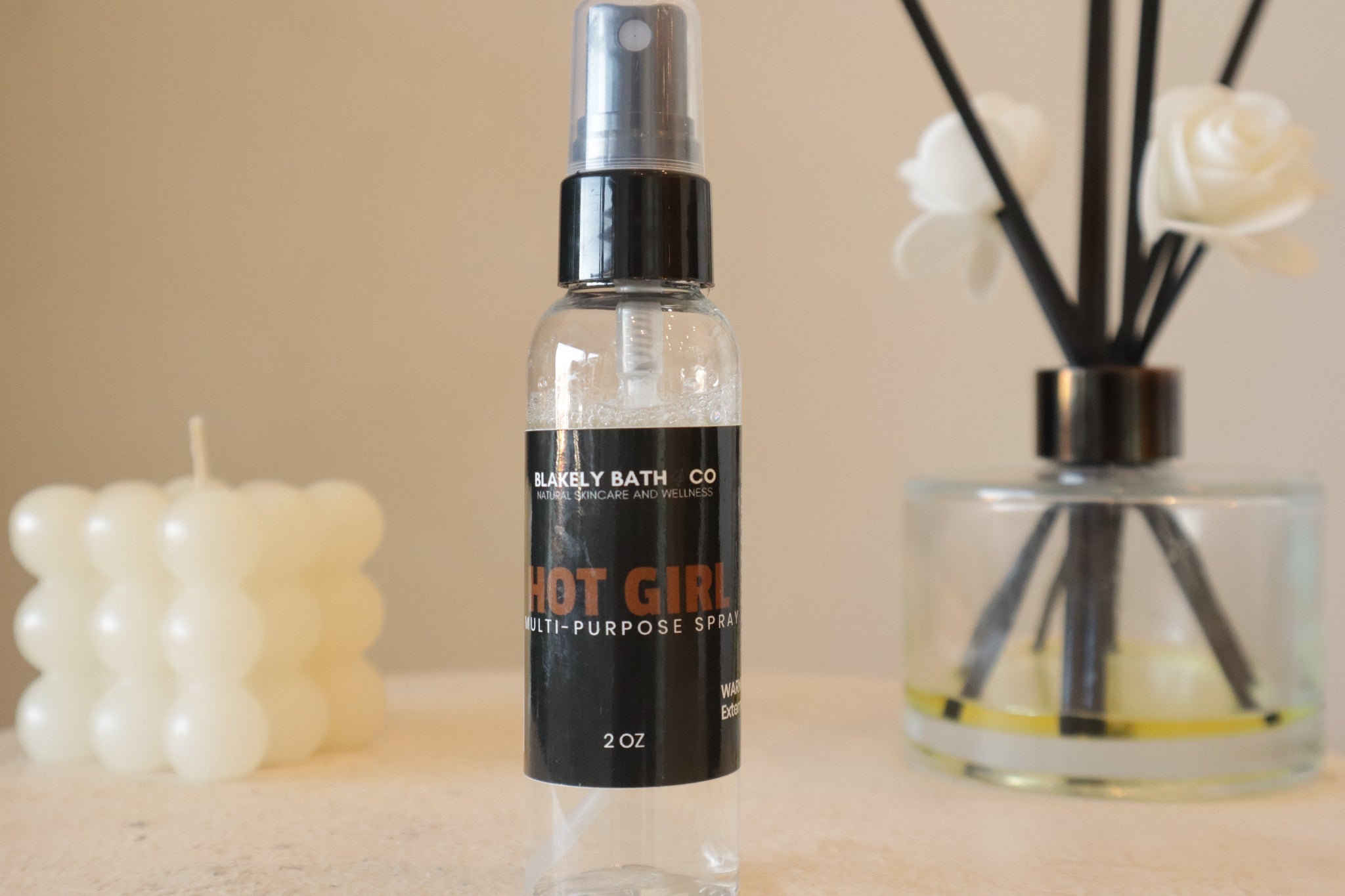 Blakely Bath & Co Hot Girl Multipurpose Spray – a luxurious, sweet-scented mist with notes of salted caramel, vanilla, sandalwood, and pistachio. Perfect for refreshing skin, hair, and fabrics on the go.