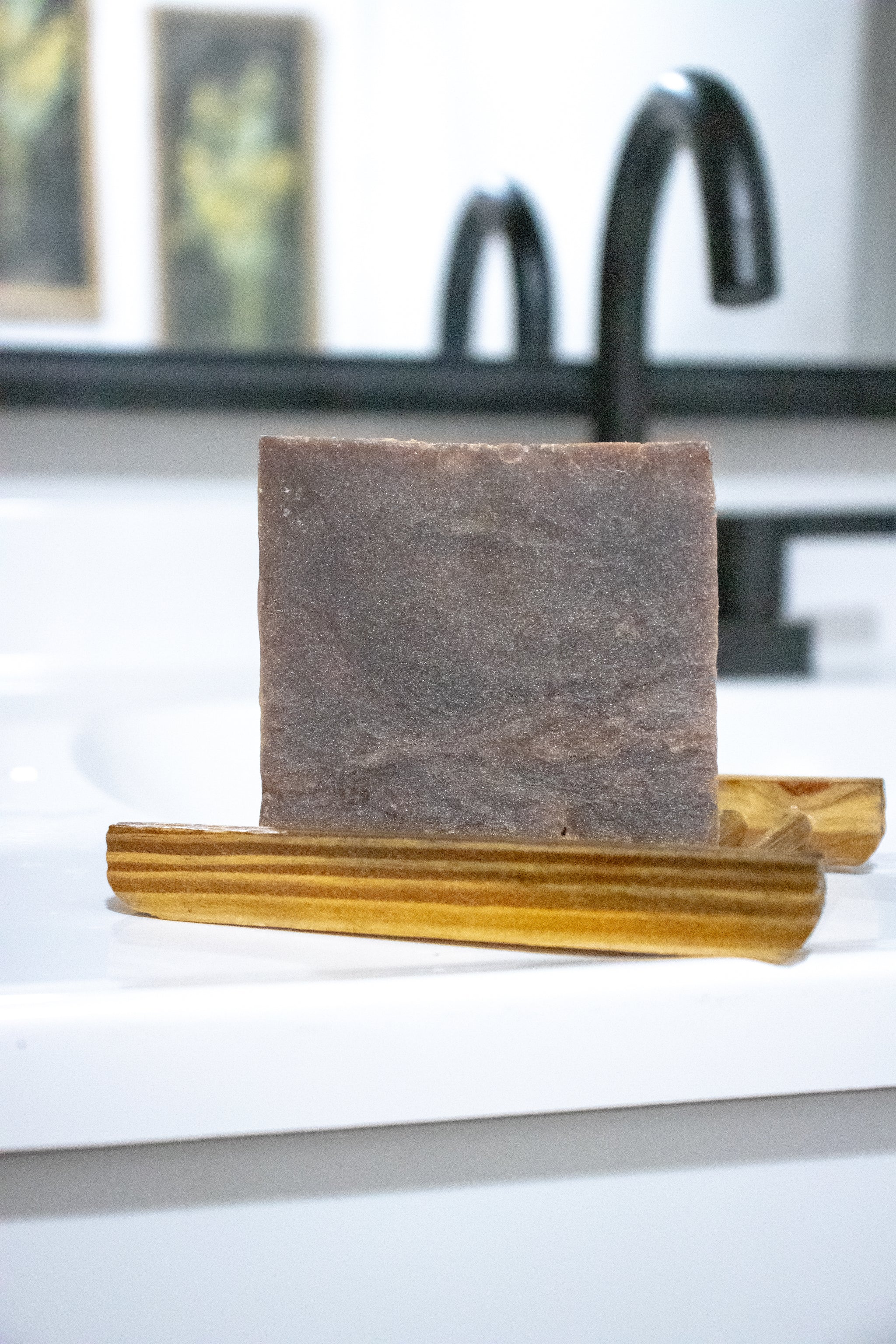 Hot Girl Bar of soap on a wooden soap dish on bathroom sink