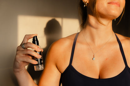 Person holding a Hot Girl Multipurpose spray at Vie Wellness Pilates. 