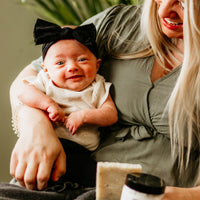 Happy baby and mom enjoying the results of the Blakely Bath & Co Dry Skin & Eczema Relief Kit, feeling good and looking good with soft, soothed, and healthy skin