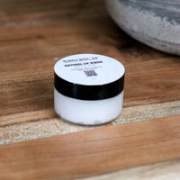 Blakely Bath & Co Vanilla Mint Lip Scrub, a natural exfoliating scrub on wooden table