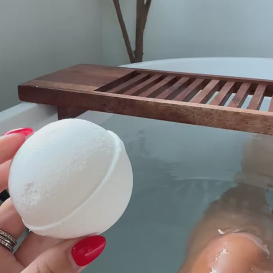 Video of Amber Rothgeb Dropping Blakely Bath & Co Detox Bath Bomb into the tub, creating a relaxing, spa-like experience with soothing bubbles and a calming aroma for ultimate relaxation