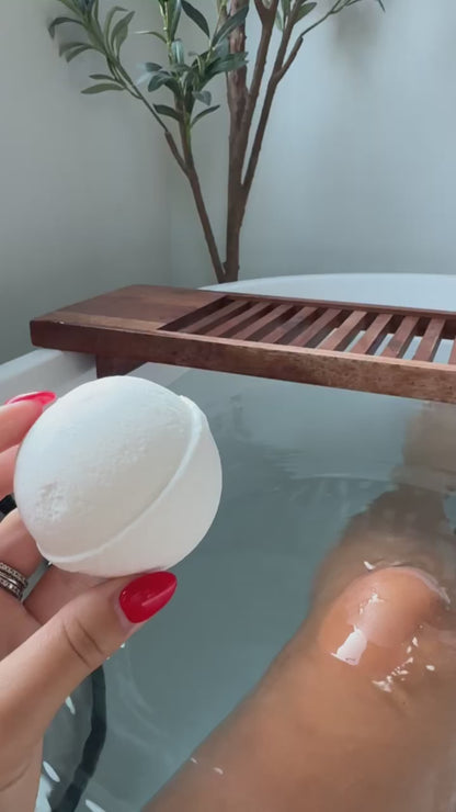 Video of Amber Rothgeb Dropping Blakely Bath & Co Detox Bath Bomb into the tub, creating a relaxing, spa-like experience with soothing bubbles and a calming aroma for ultimate relaxation