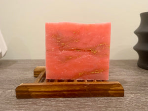 Rosé Gold Soap Bar with rose gold shimmer sitting on a table – natural goat milk soap for dry, sensitive skin.