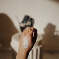 Woman's hand smeared with Silk Dream Moisturizing Cream by Blakely Bath & Co – showcasing its rich, hydrating texture that transforms dry skin and dry hands into smooth, nourished skin.