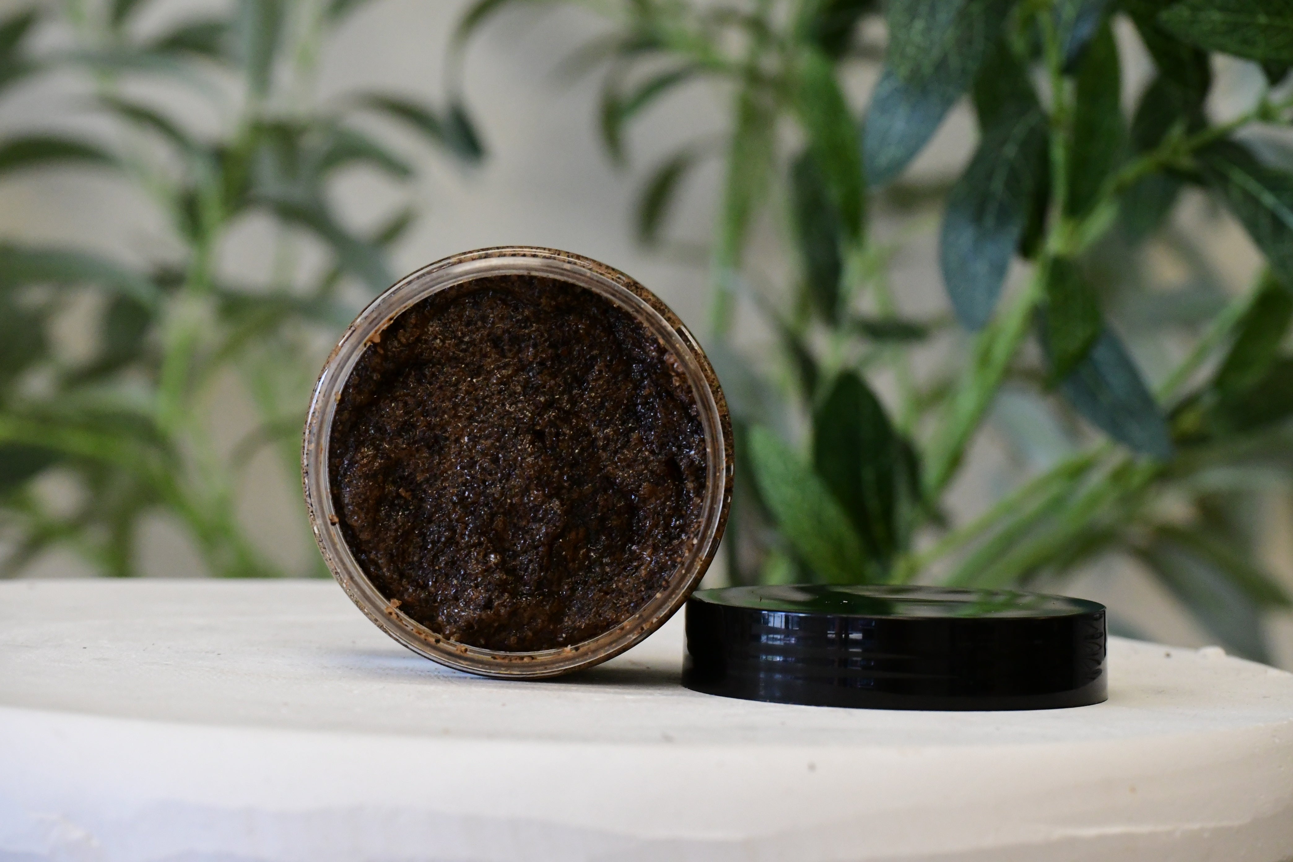 Blakely Bath & Co Coffee Anti-Aging Scrub with the top off, showcasing the rich, exfoliating scrub made with coffee grounds to help rejuvenate and firm skin while reducing fine lines and wrinkles"