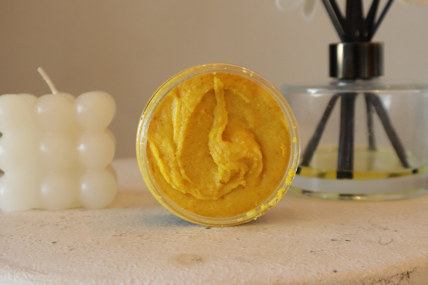 Blakely Bath & Co ThatGlo Turmeric & Kojic Acid Scrub – a rich, golden-yellow orange exfoliator with a creamy, texture