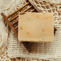Blakely Bath & Co Eco-Friendly Bamboo Soap Dish holding turmeric soap bar, offering a sustainable solution to keep your soap dry and extend its life, with a natural, minimalist design
