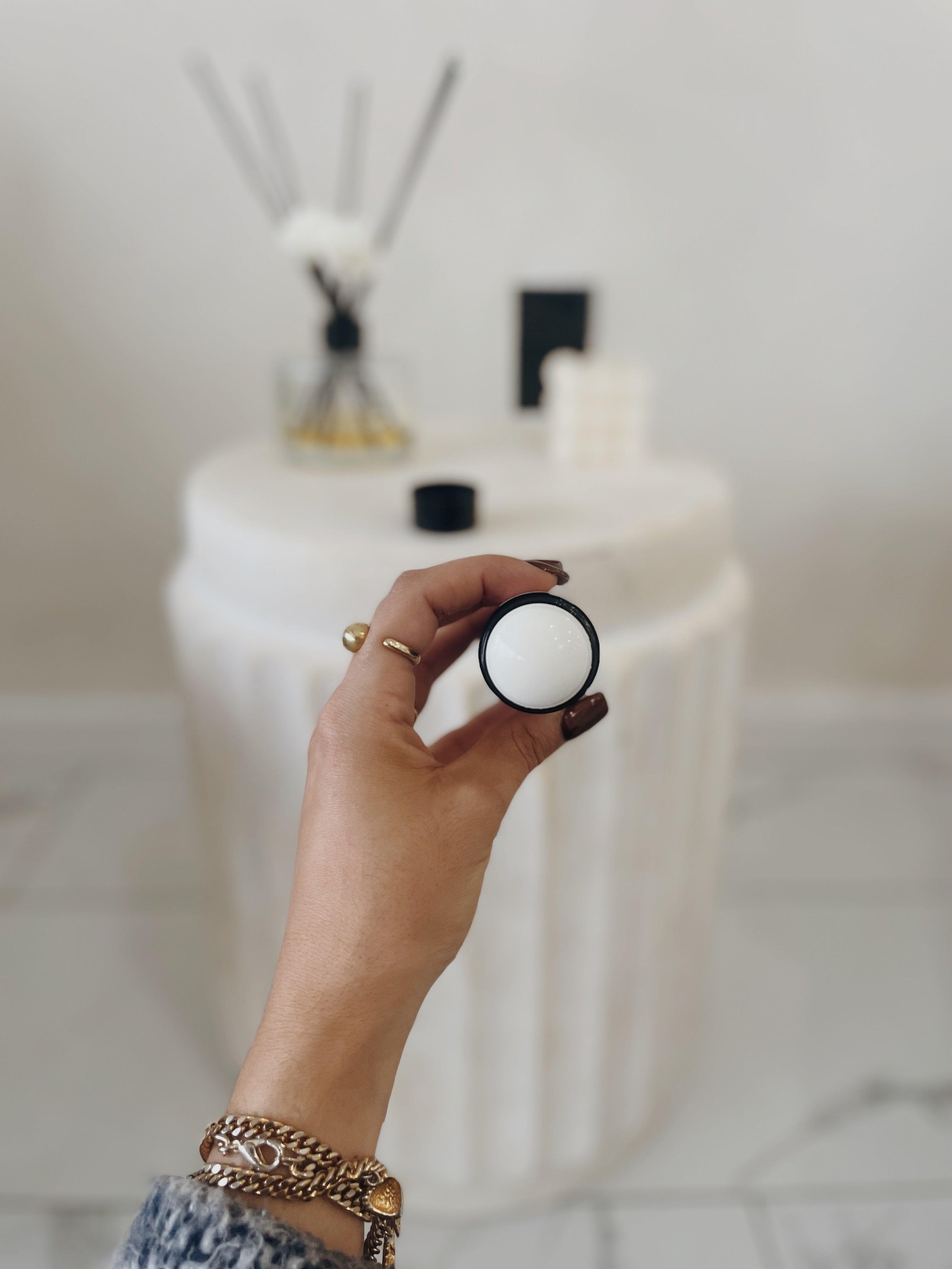 Tessa Chaplin showcasing Blakely Bath & Co's Vanilla Aluminum-Free Deodorant with the top off, revealing the smooth, natural formula inside, perfect for long-lasting freshness and a soothing vanilla scent